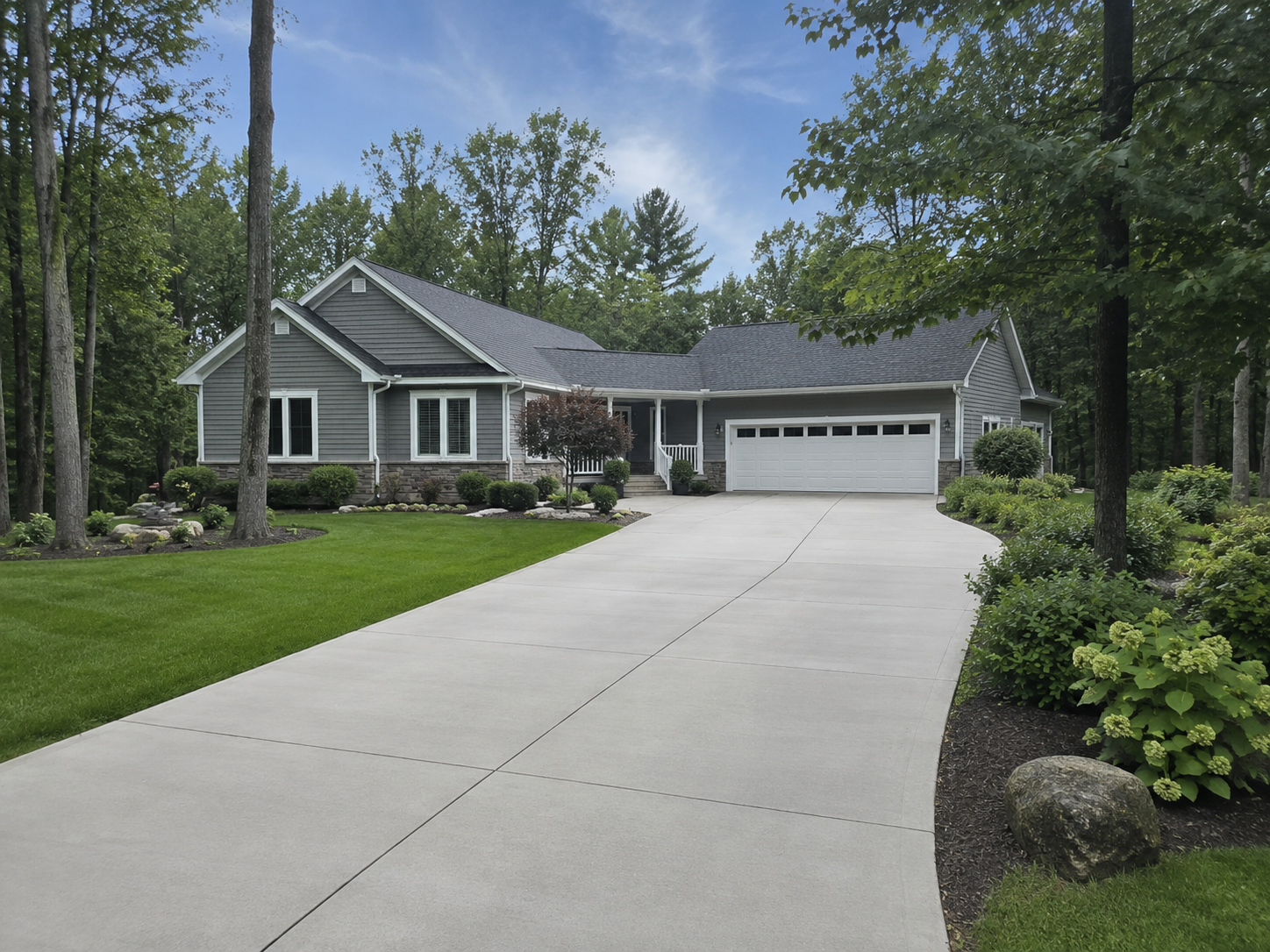 Clean concrete driveway in Traverse City MI after professional pressure washing