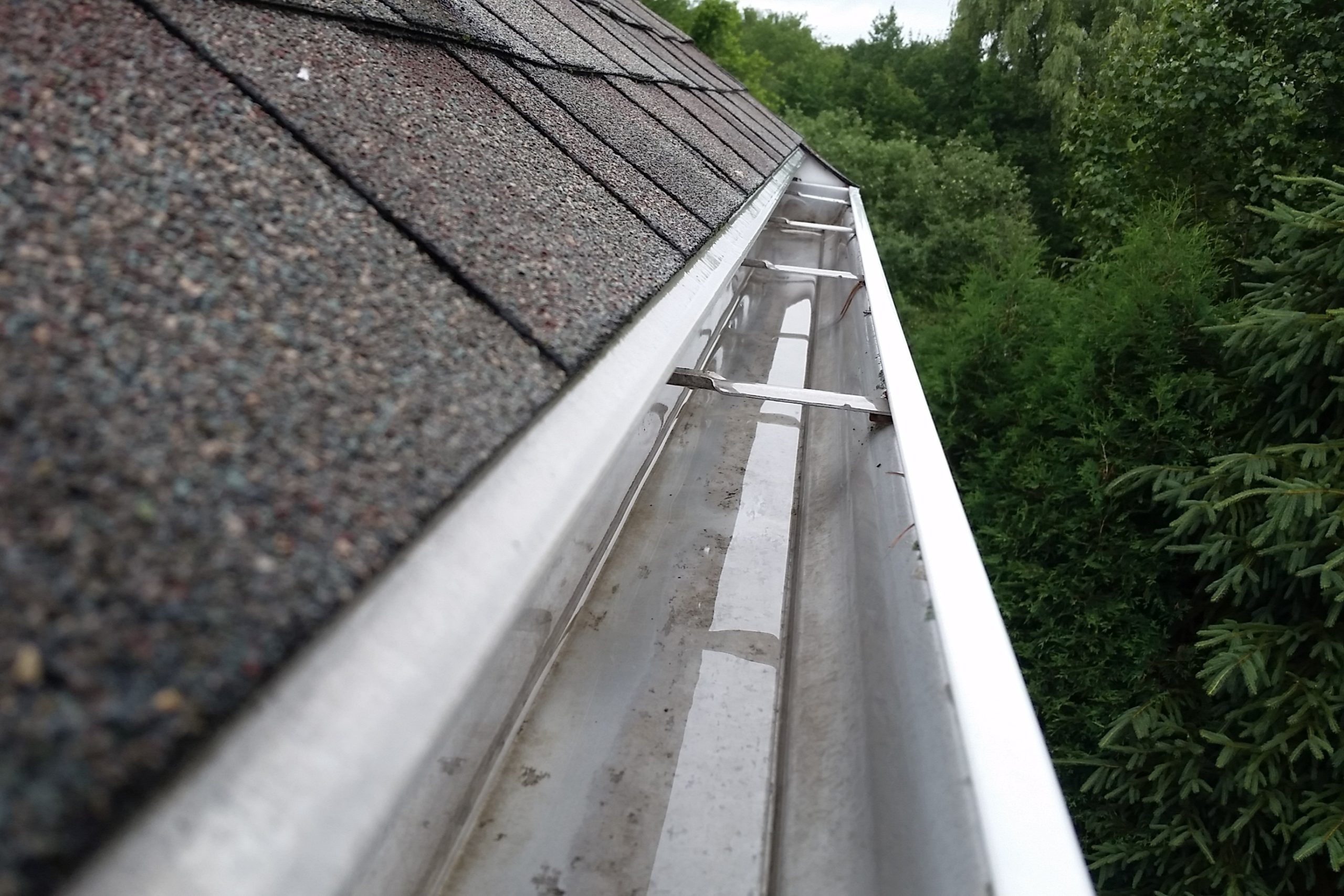 Clean gutters on home in Traverse City MI by Anchor Pro Wash