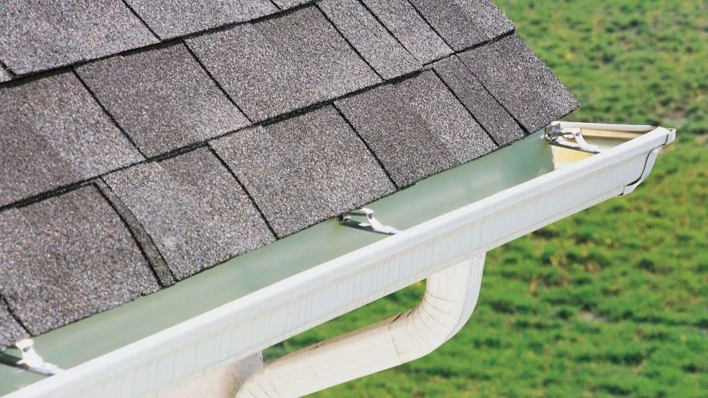 Clean gutters and fascia on home in Traverse City MI