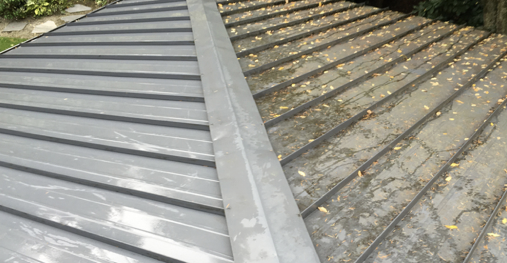 Metal roof before and after soft wash treatment in Northern Michigan