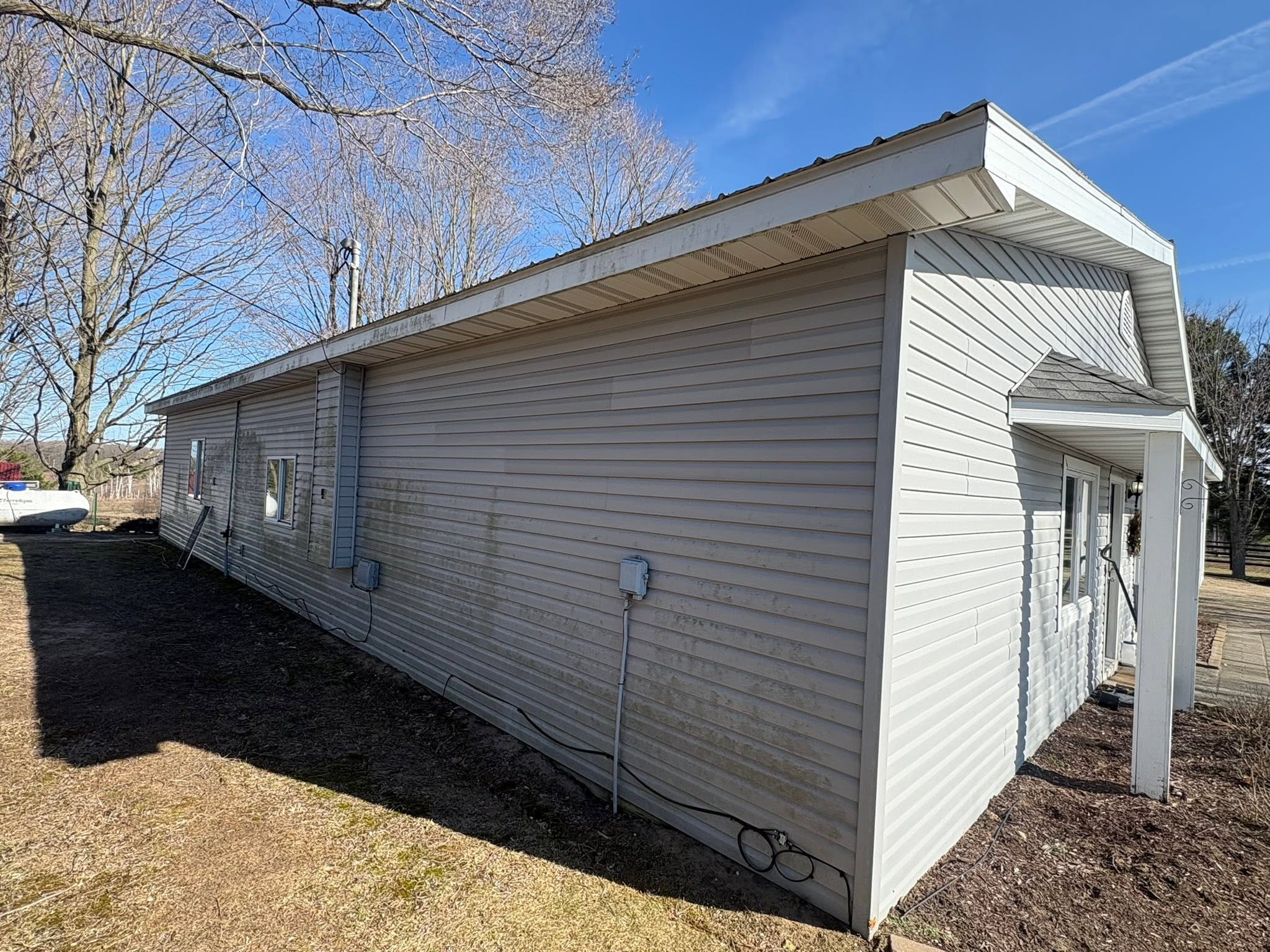 House siding before pressure washing